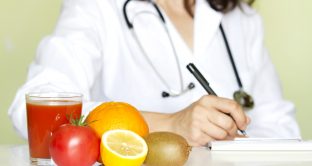 Doctor nutritionist in office with healthy fruits diet concept