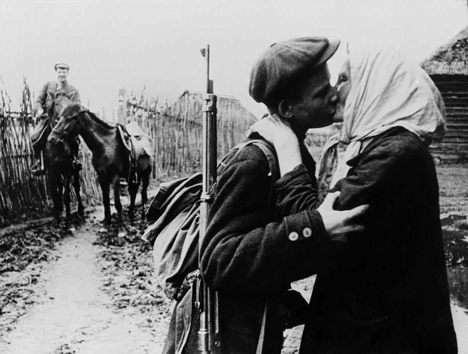 A mother kissing her son goodbye as he leaves to join the partisans during WWII, Leningrad, 1942.jpg